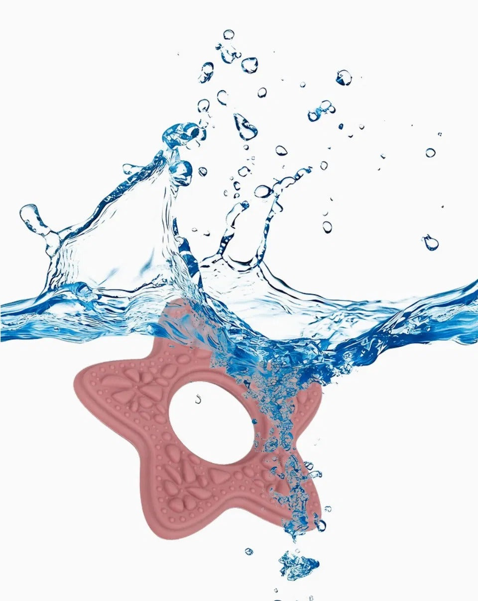 Snuglet teether being rinsed with water